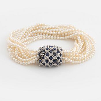 Cultured pearl bracelet, eleven strand, clasp white gold with sapphire and diamonds.