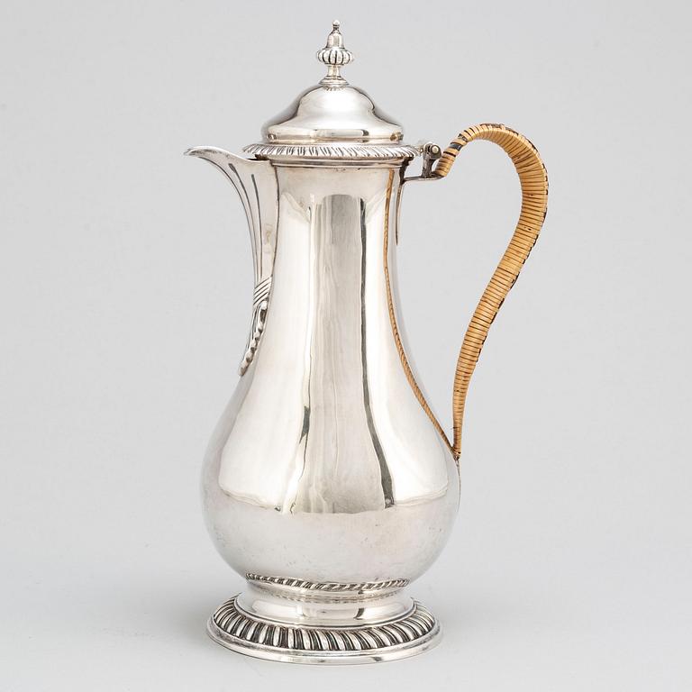 An English 18th century silver wine jug, mark of Augustin Le Sage, London 1770.