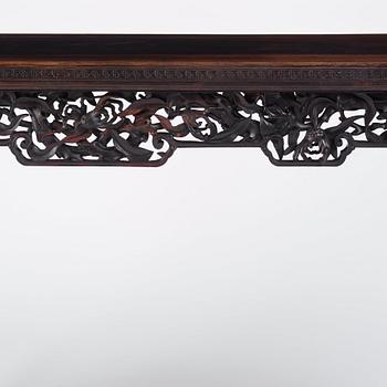 A massive zitan recessed-leg long table 'Jiaotousun Qiotouan', Qing dynasty, 19th century.
