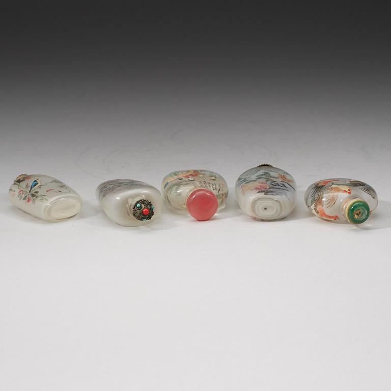 A group of five Chinese inside decorated snuff bottles with stoppers, early 20th Century.