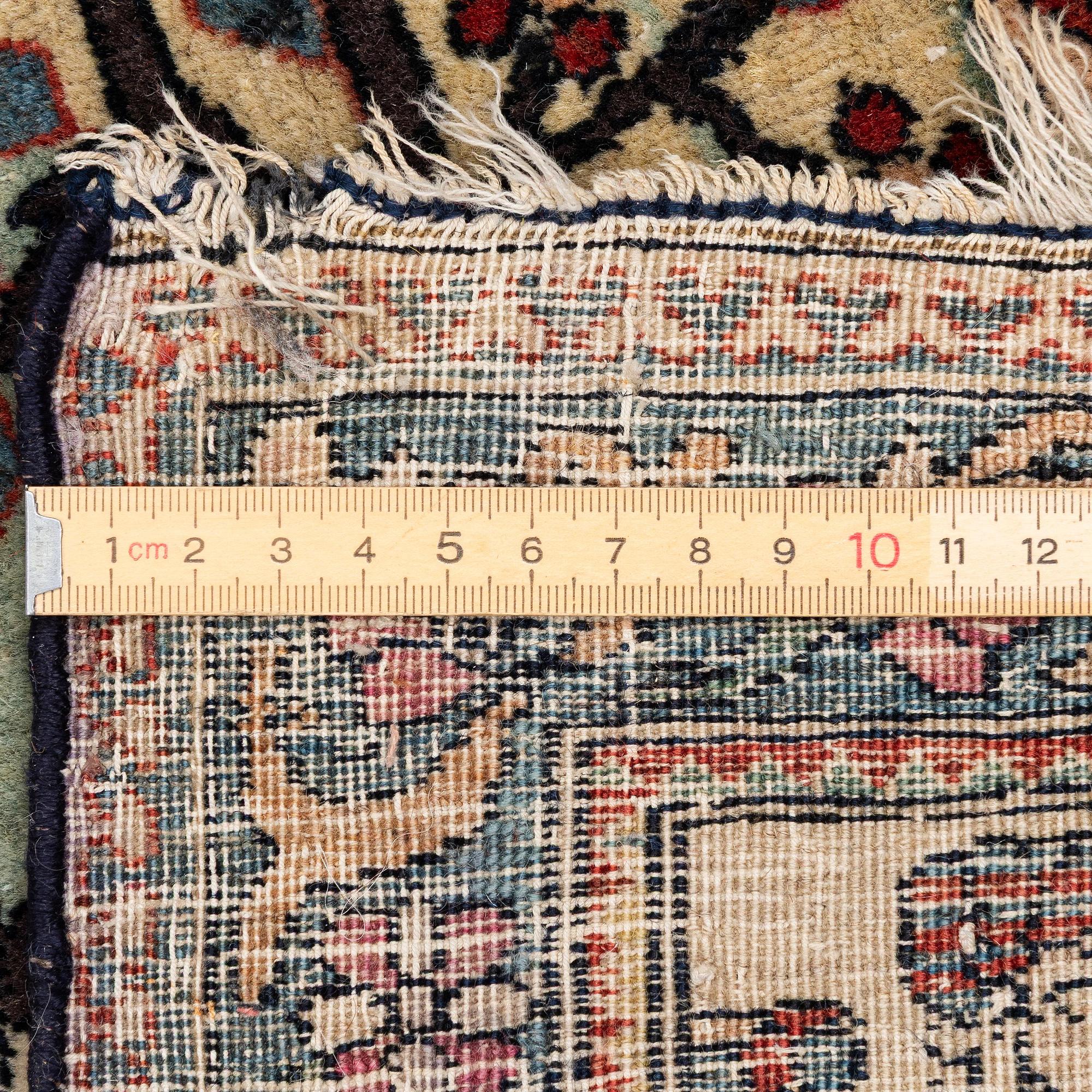 An antique Isfahan carpet, Central Persia, c. 260 x 138 cm.