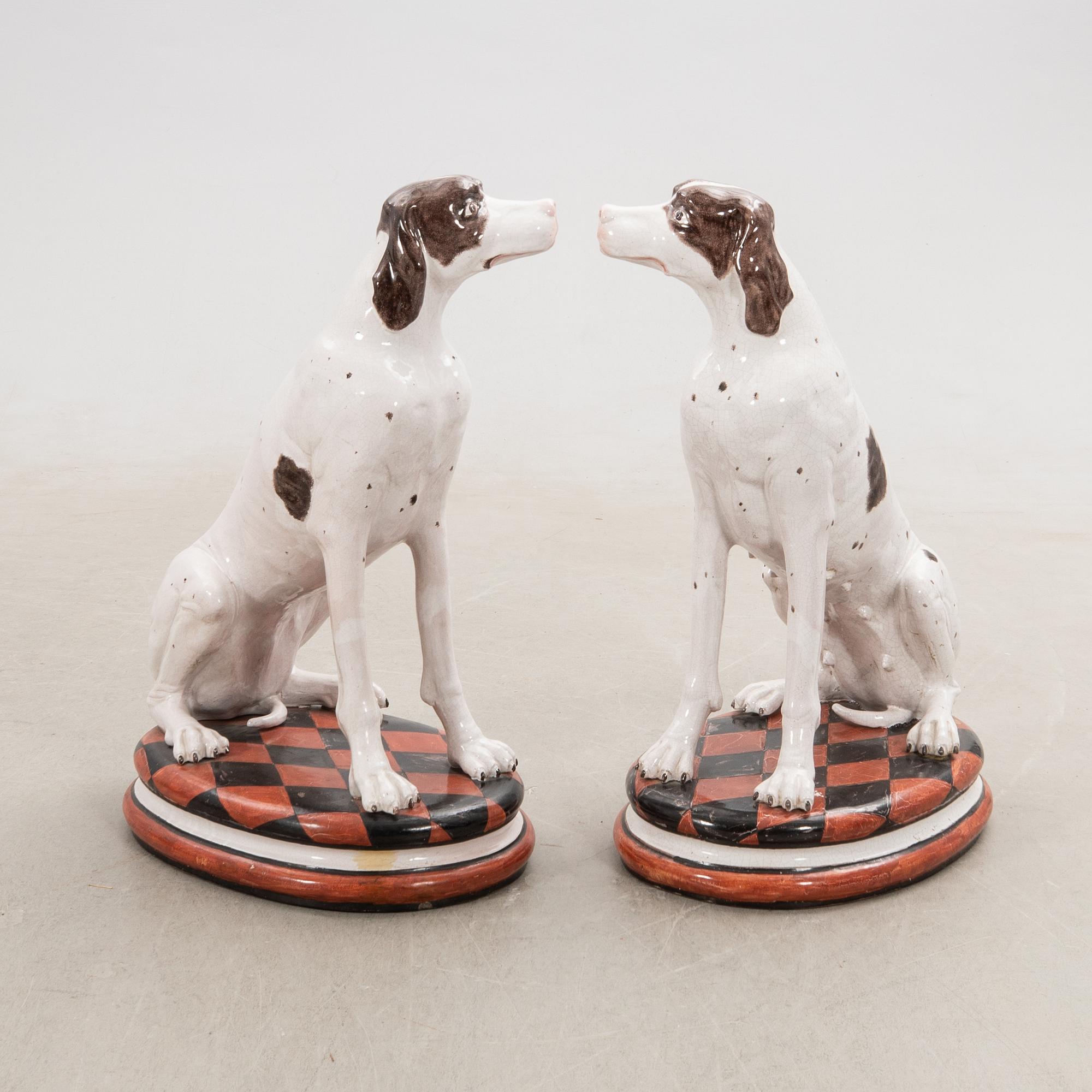 Decorative sculptures a pair England 20th century glazed ceramics.