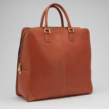 LOUIS VUITTON, a brown leather handbag.