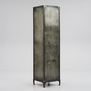 A contemporary patinated metal cabinet.