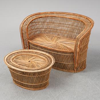 A late 20th Century rattan sofa with table.