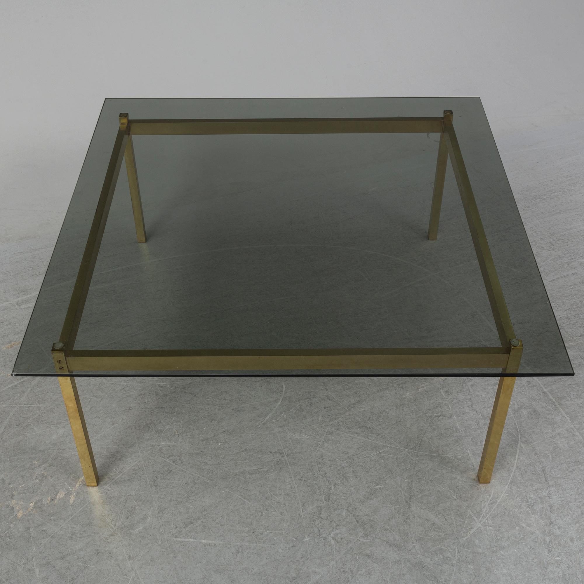 A 1960-70's brass and glass coffee table.
