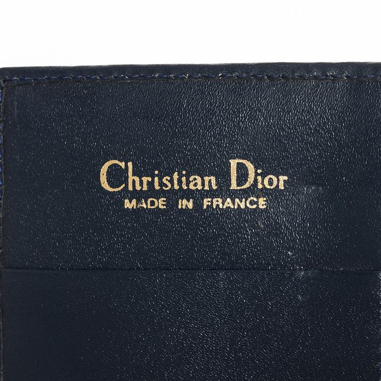 Christian Dior, a wallet.