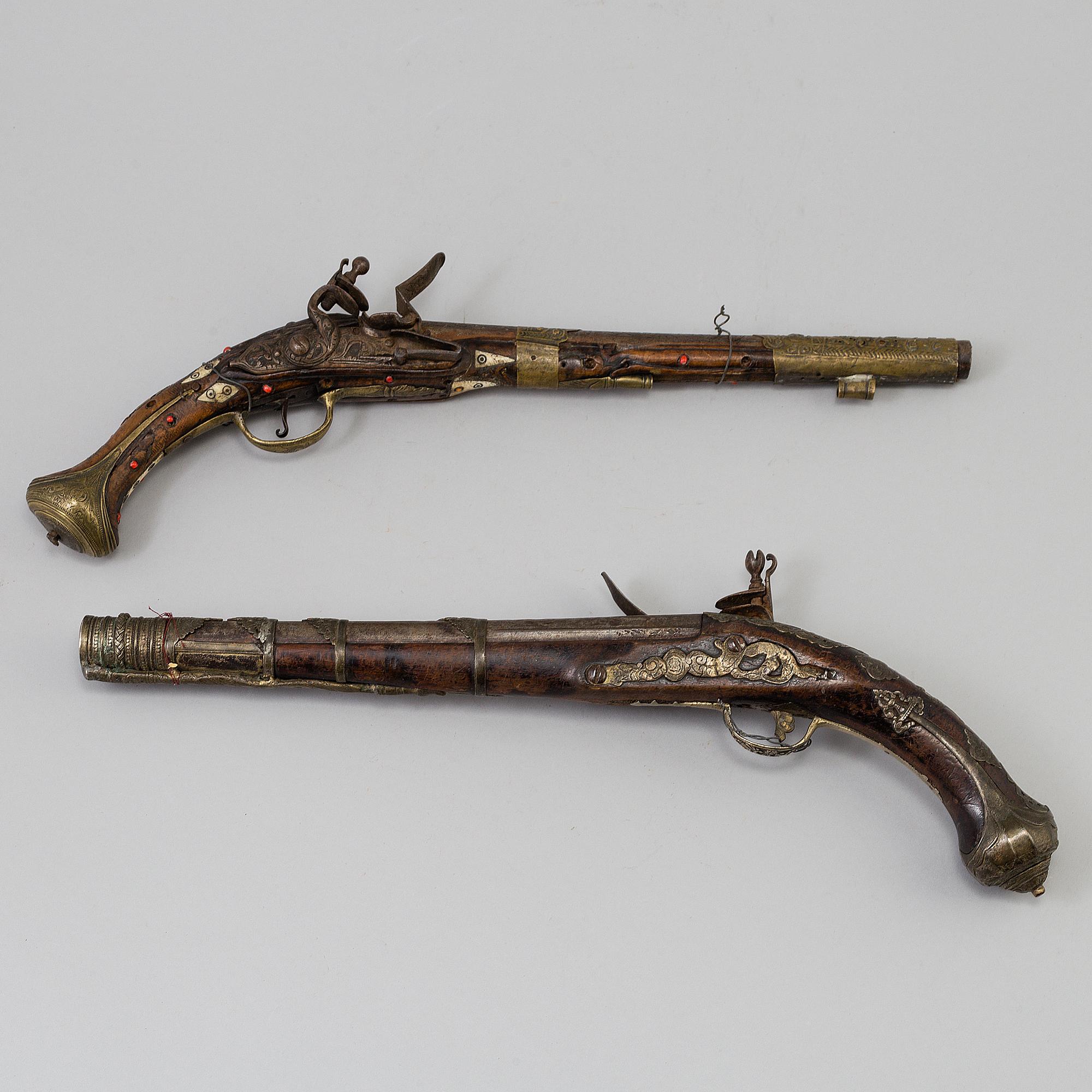 Two 19th century flintlock pistols.