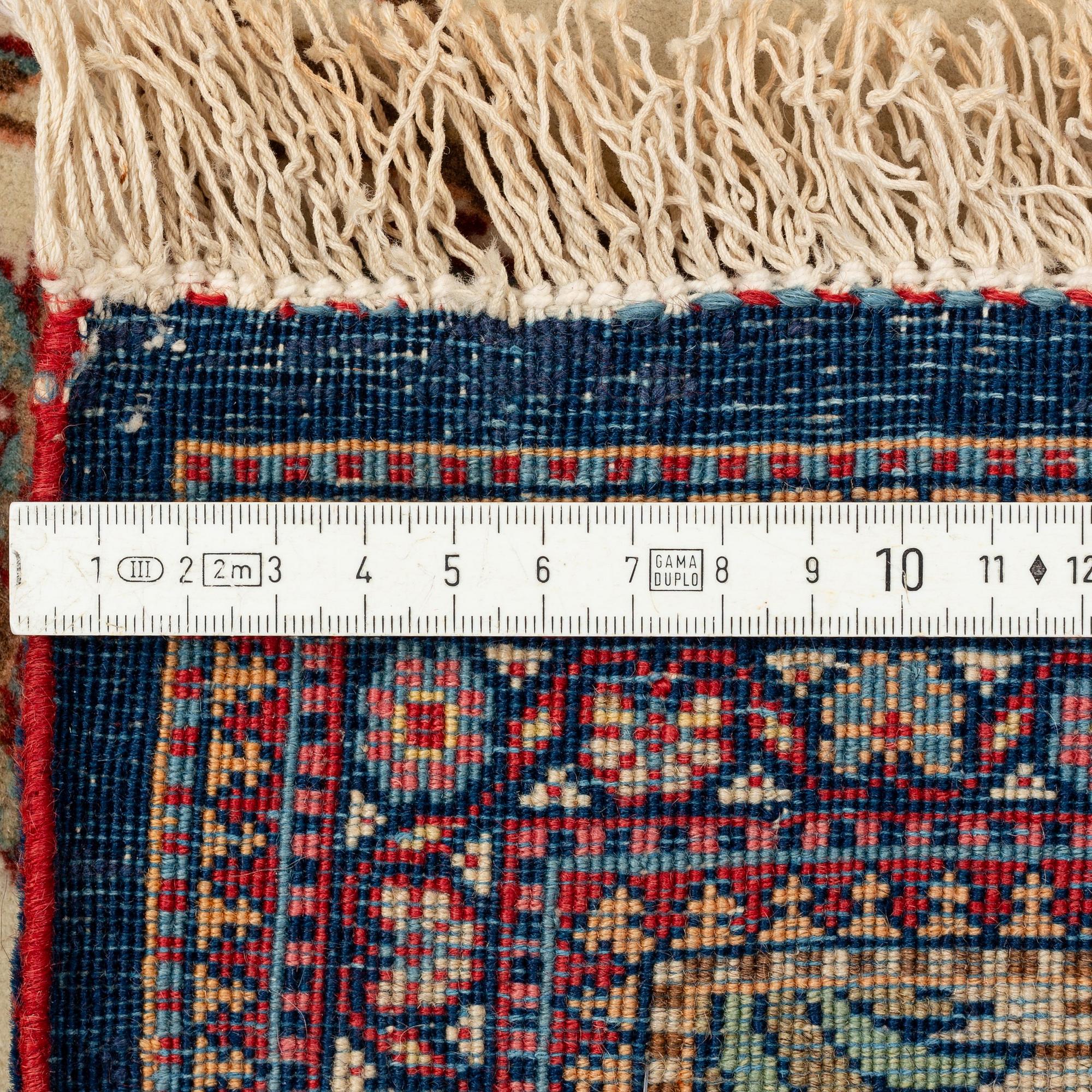A signed Kashan 'Dabir' carpet, ca 206 x 136 cm.