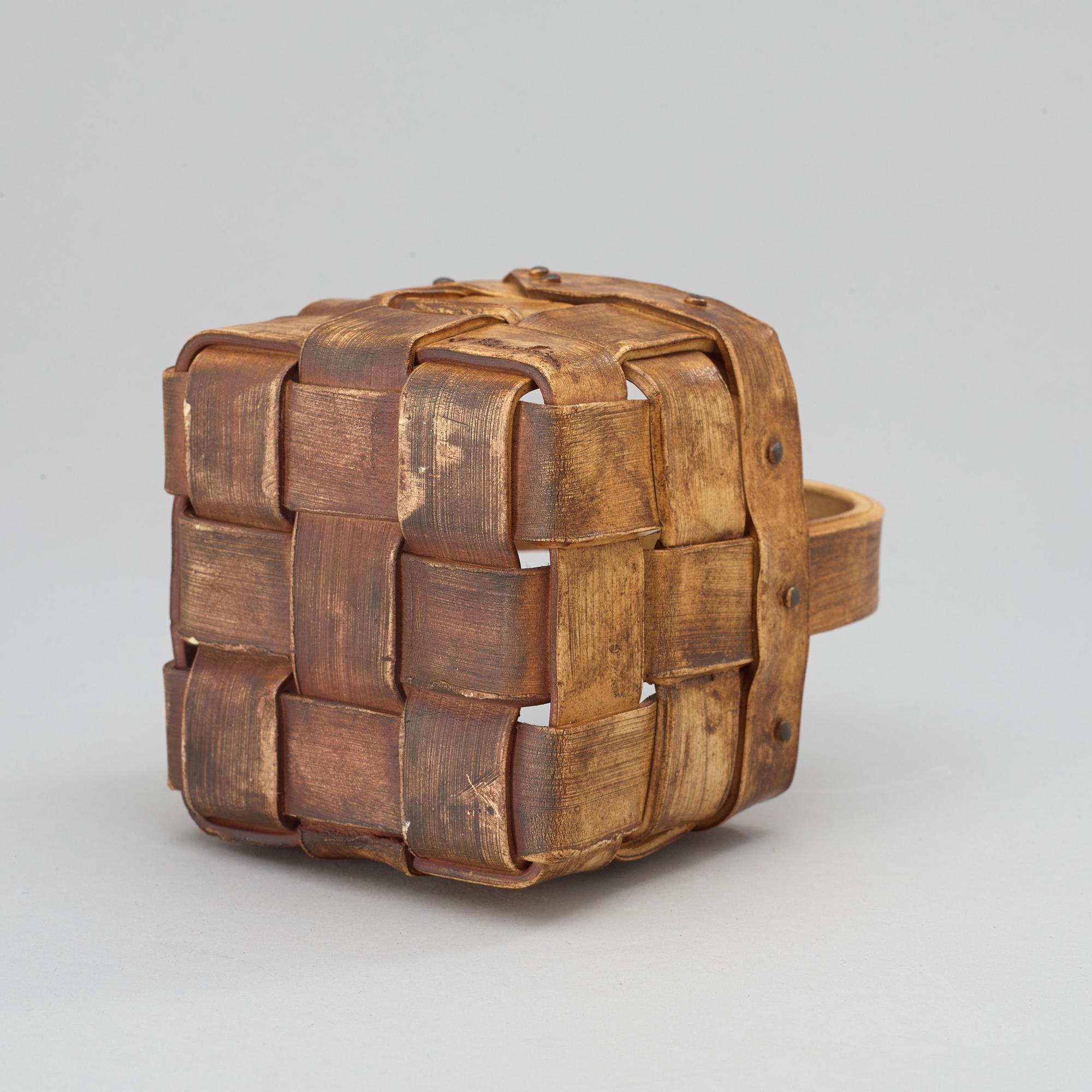 An Ingrid Herrlin stoneware blueberry basket with two lingonberries, Båstad, Sweden.