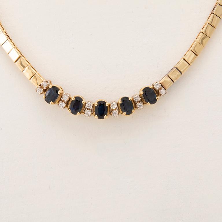 An 18K white and yellow gold necklace set with oval-cut sapphires and round brilliant-cut diamonds.