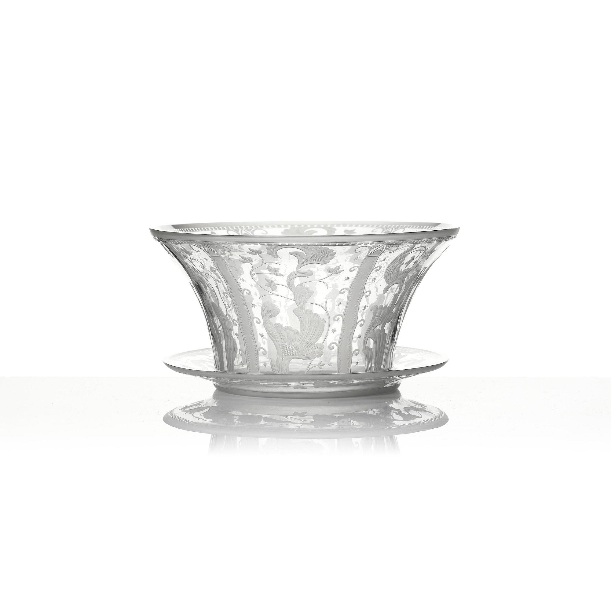 Simon Gate, an engraved Swedish Grace glass bowl on a plate, Orrefors, Sweden 1926, model 147.