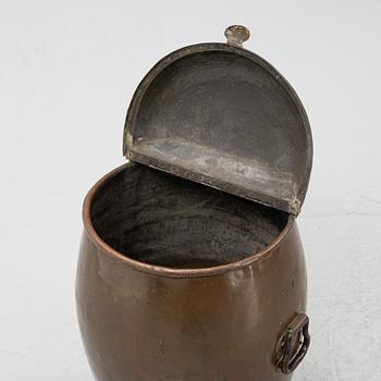 A copper water container, on iron stands.19th Century.