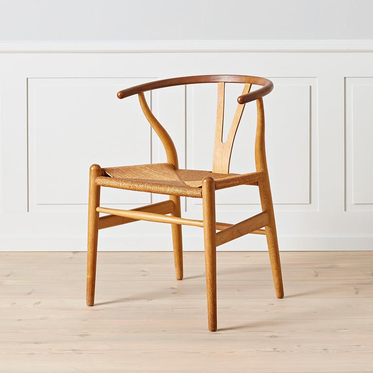 Hans J. Wegner, An early oak and teak 'Wishbone chair' by Carl Hansen & Son, Denmark, 1950's.