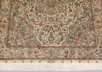 An Oriental silk rug, approx. 153 x 95 cm.