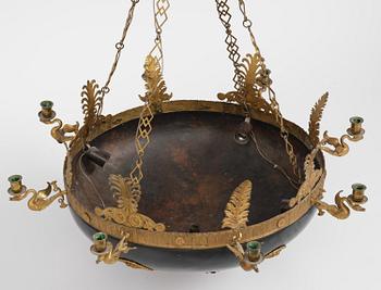 A presumably Russian Empire gilt and patinated bronze nine-branch chandelier, 19th century.