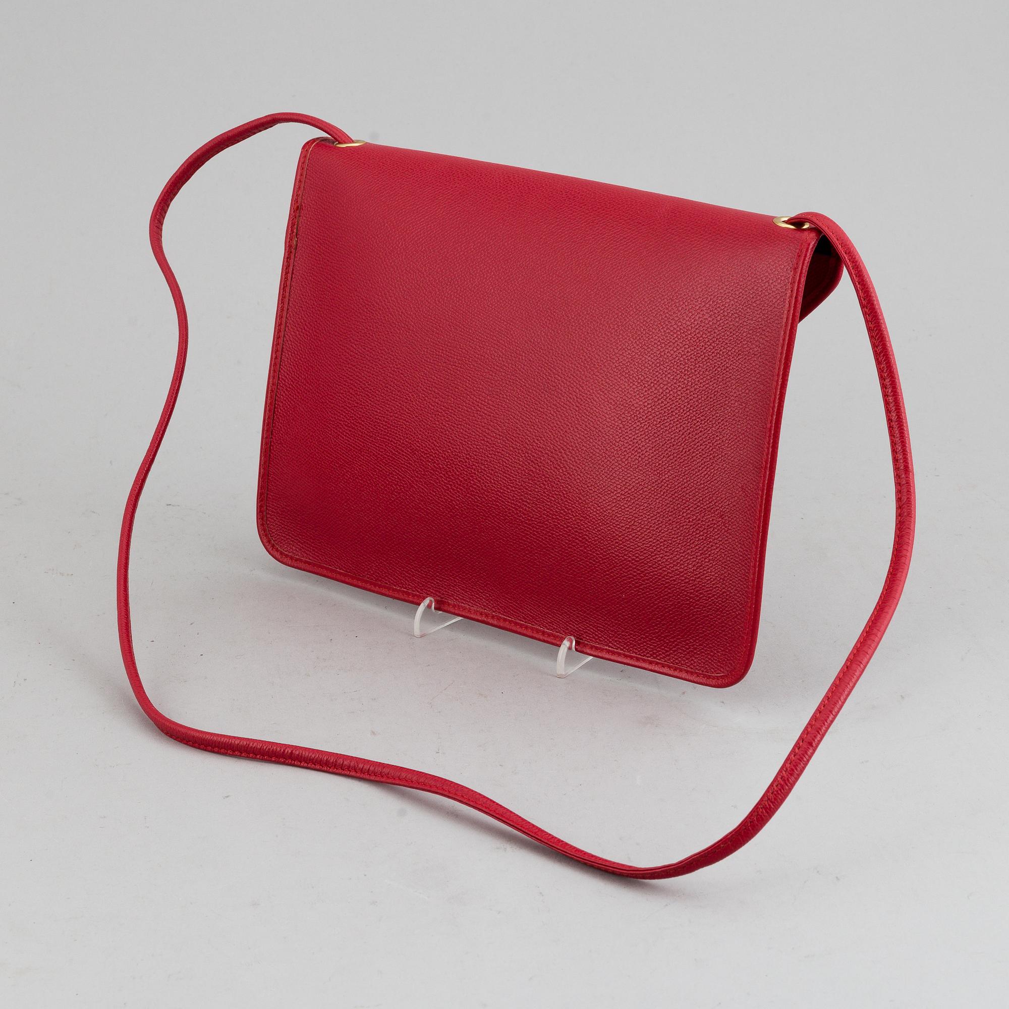 YVES SAINT LAURENT, a red leather bag.