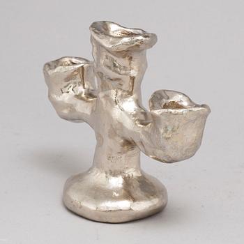 DAN WOLGERS, a silvergilt bronze candle stick, signed.