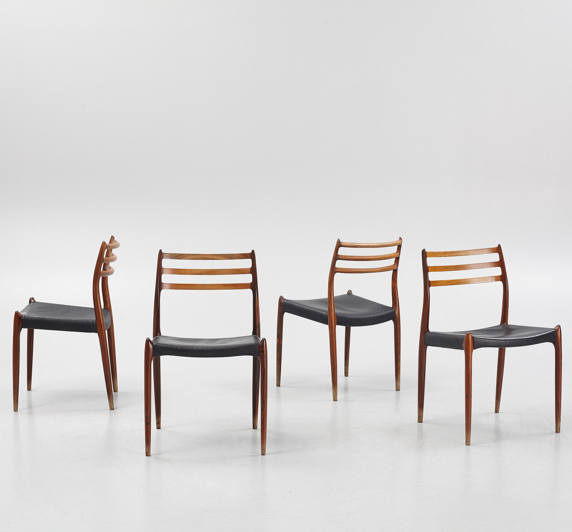 Niles Otto Møller, a rosewood veneered table with four chairs, JL Møller, Denmark, 1950's/60's.