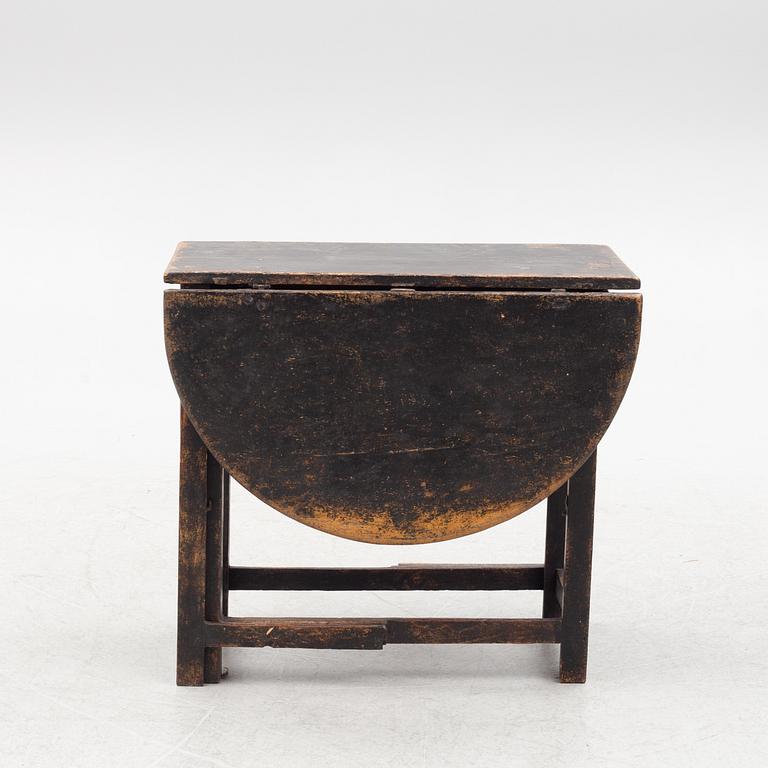 A Swedish wooden table, 19th century.