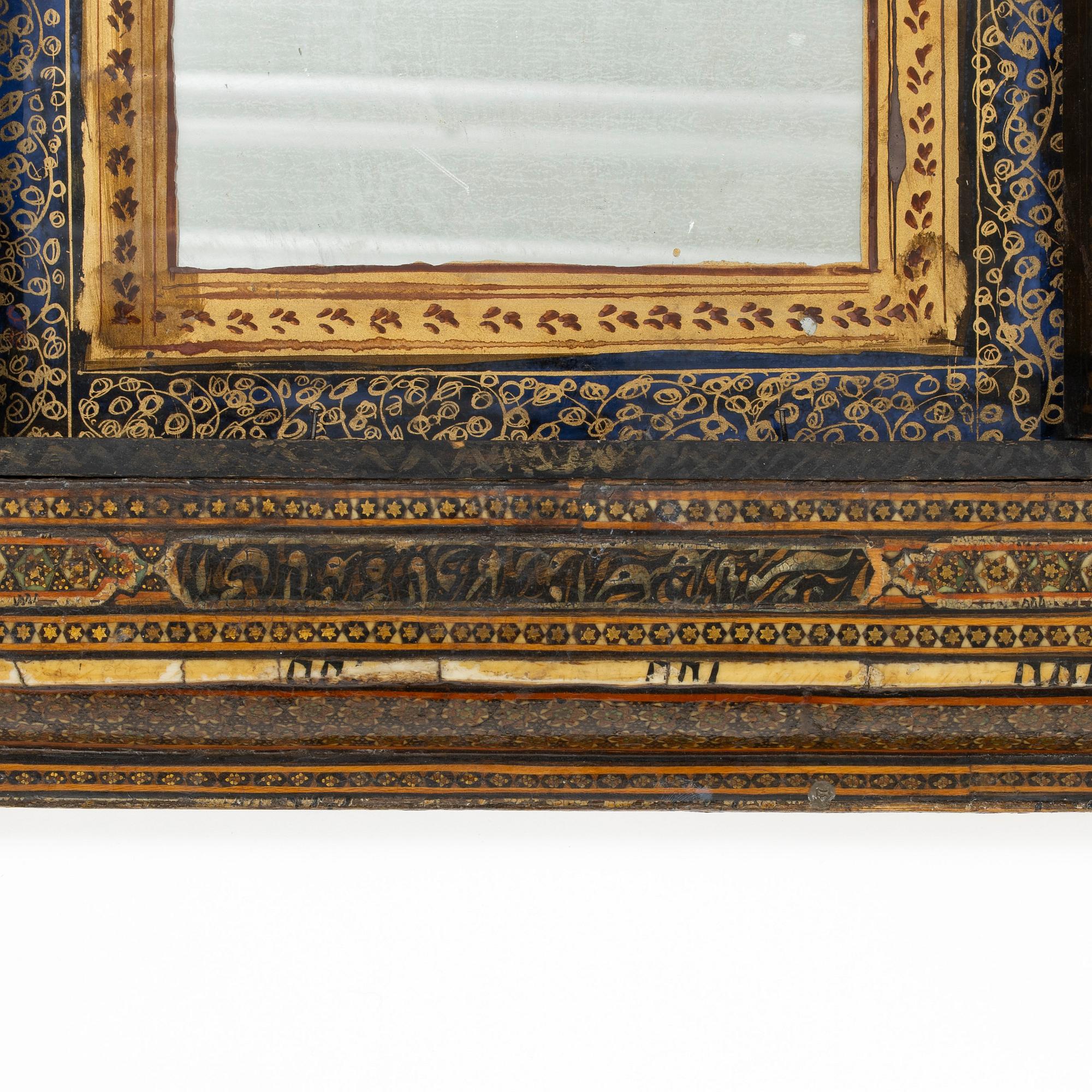 A Qajar Khatamkari laque mirror, circa 1900.