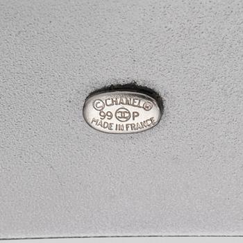 CHANEL, a black leather belt.
