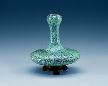 A rare porcelain vase on stand, Qing dynasty.