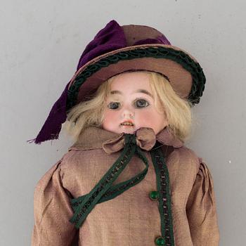 An early 20th cnetury porcelin doll, probably Germany.