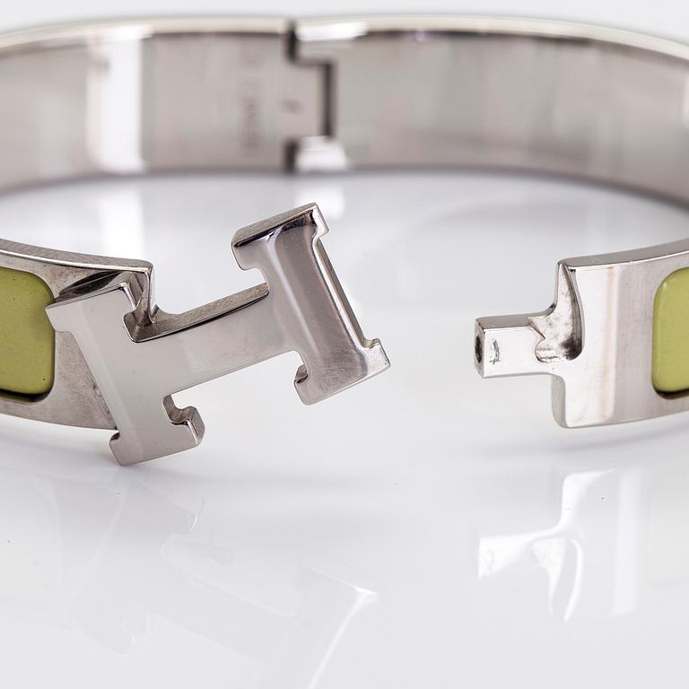Hermès, a 'Clic H' PM bracelet.