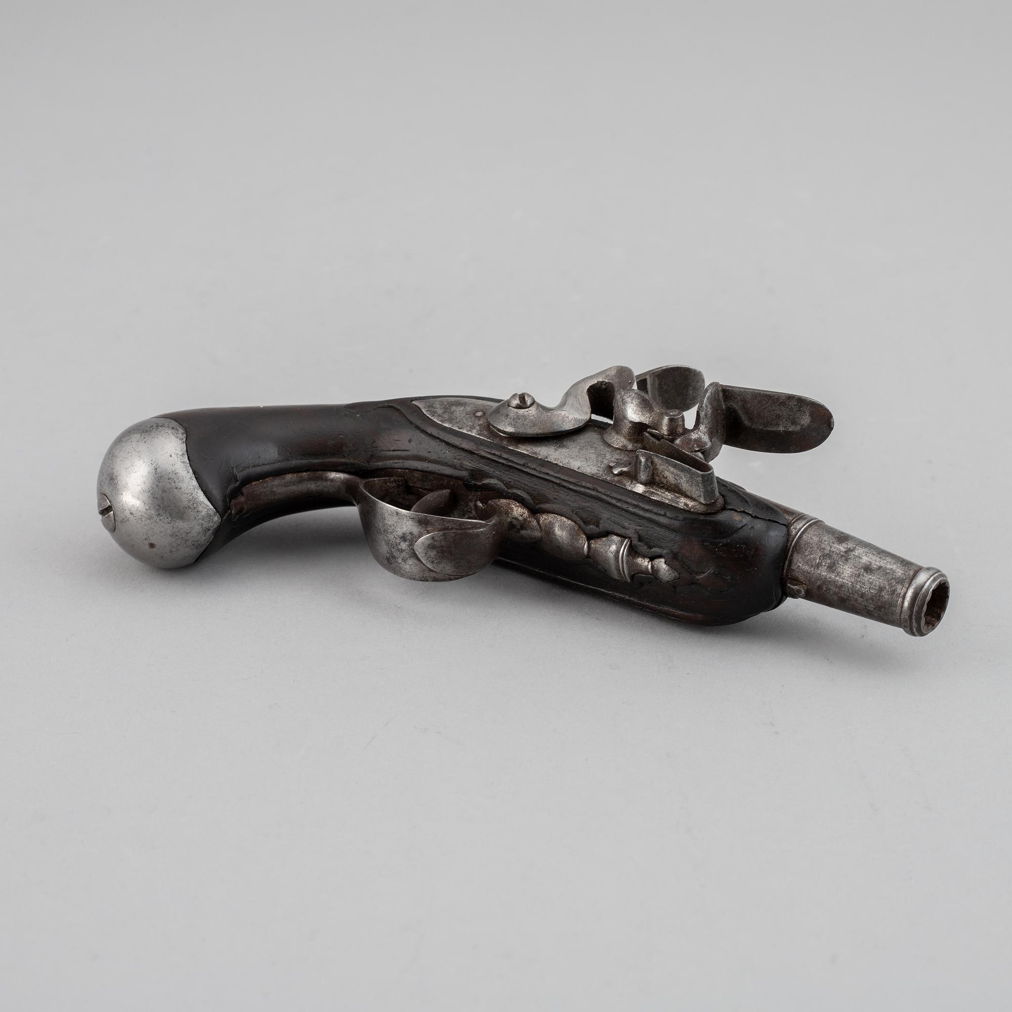 A 18th Century flintlock pistol.