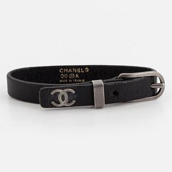 CHANEL, a leather bracelet.