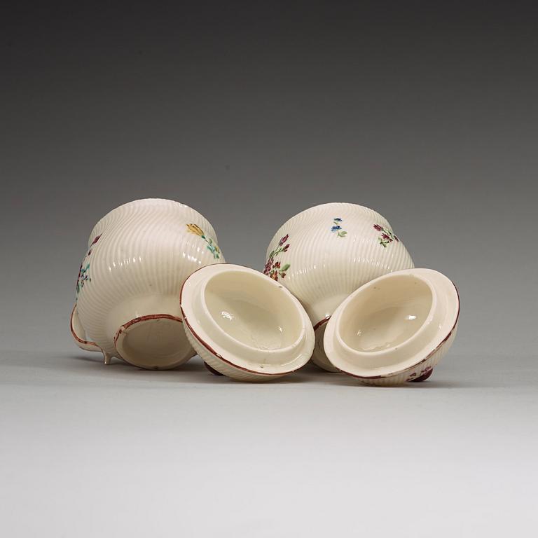 A pair of Swedish soft paste custard cups with covers, Marieberg, 18th Century.