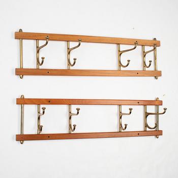 A pair of 'Dekorativ' coat hangers, Skoglunds metallgjuteri, Anderstorp, mid 20th Century.