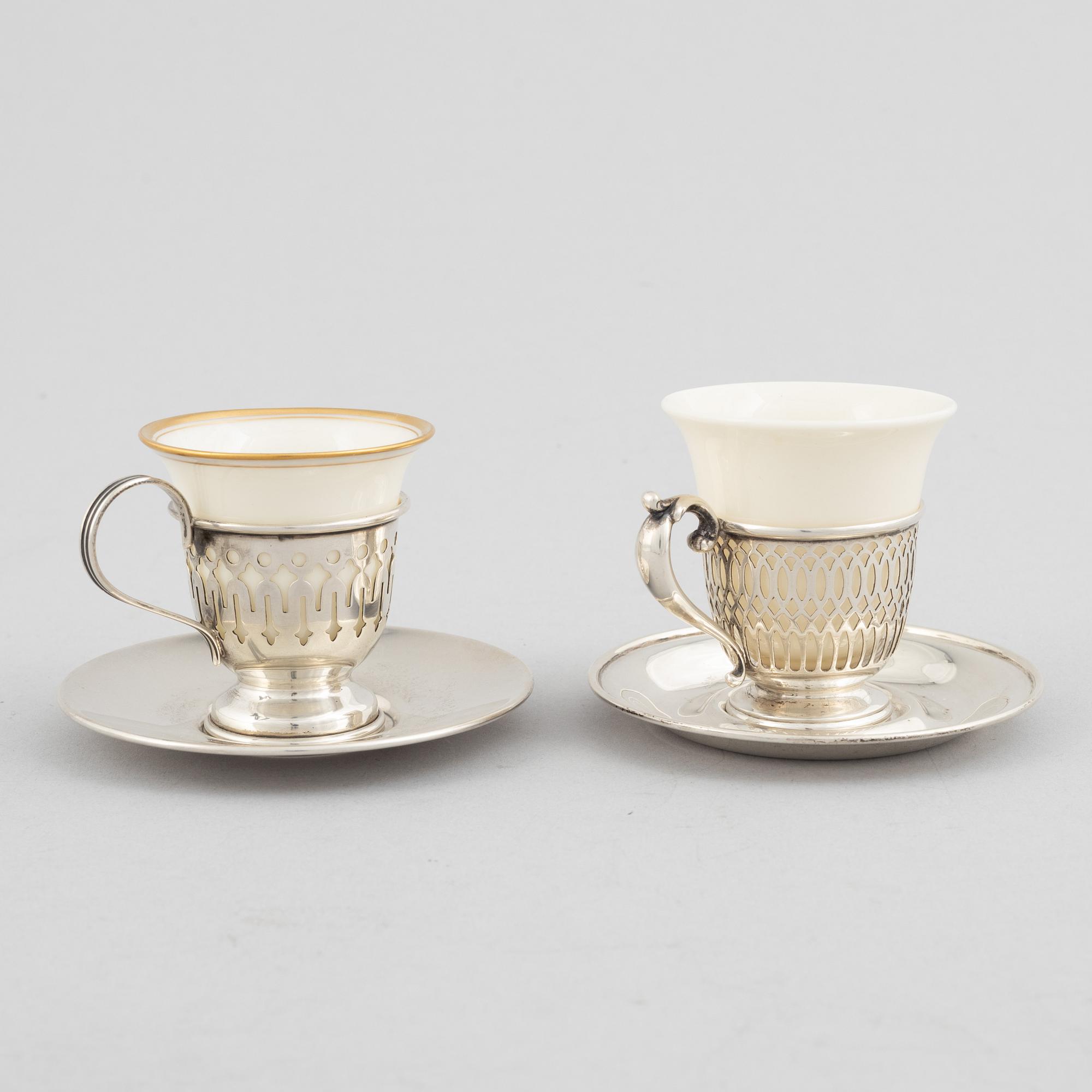 Kopphållare med fat, 6+6 st, sterlingsilver och porslin, bl.a. John Wanamaker, Philidelphia, USA, tidigt 1900-tal.