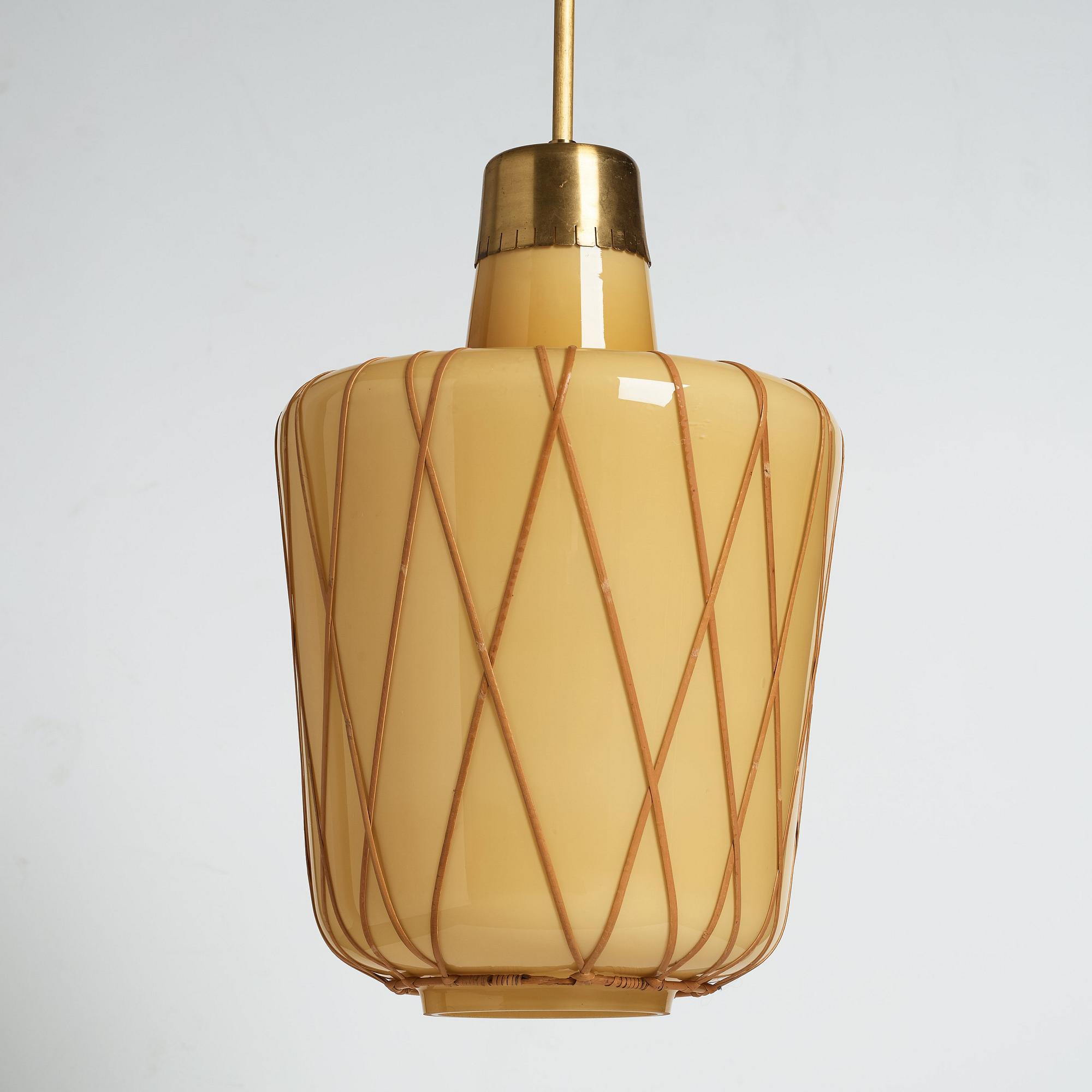 A pair of Swedish Modern vanilla coloured glass ceiling lights with fretted rattan, 1930-40's.