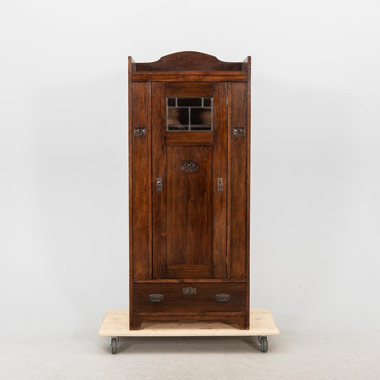 An early 1900s oak cabinet.