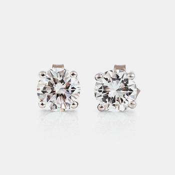 1230. A pair of brilliant-cut diamond earrings. 1.11 ct and 1.00 ct. Quality circa F-G/VVS2.