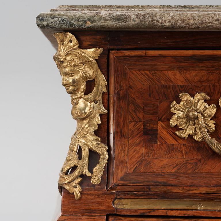 A Swedish early rococo parquetry, ormolu-mounted and marble commode, presumably by S. Pasch or J. Wulf , ca. 1740.