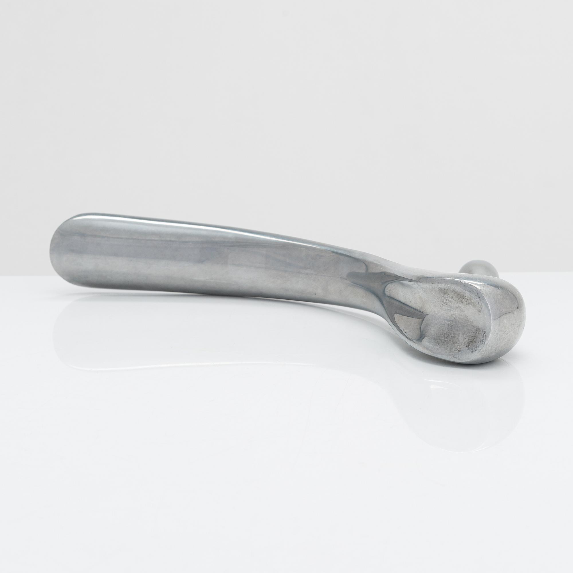 A metal shoe horn by Manolo Blahnik, 2000s.