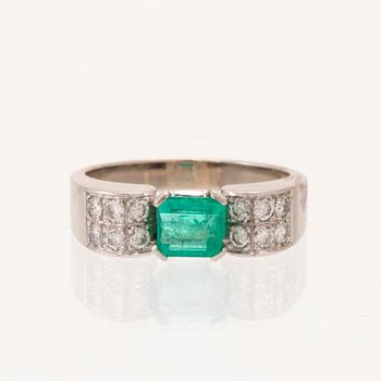 W.A. Bolin, ring 18K white gold with a rectangular step-cut emerald and round brilliant-cut diamonds, Stockholm 1976.