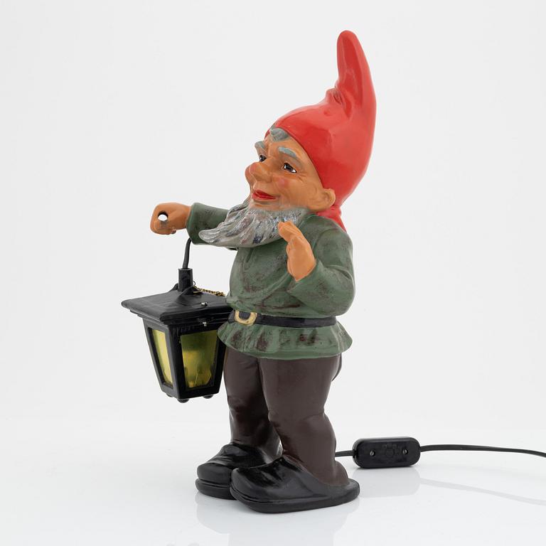 A West German earthenware gnome with lantern from the second half of the 20th century.