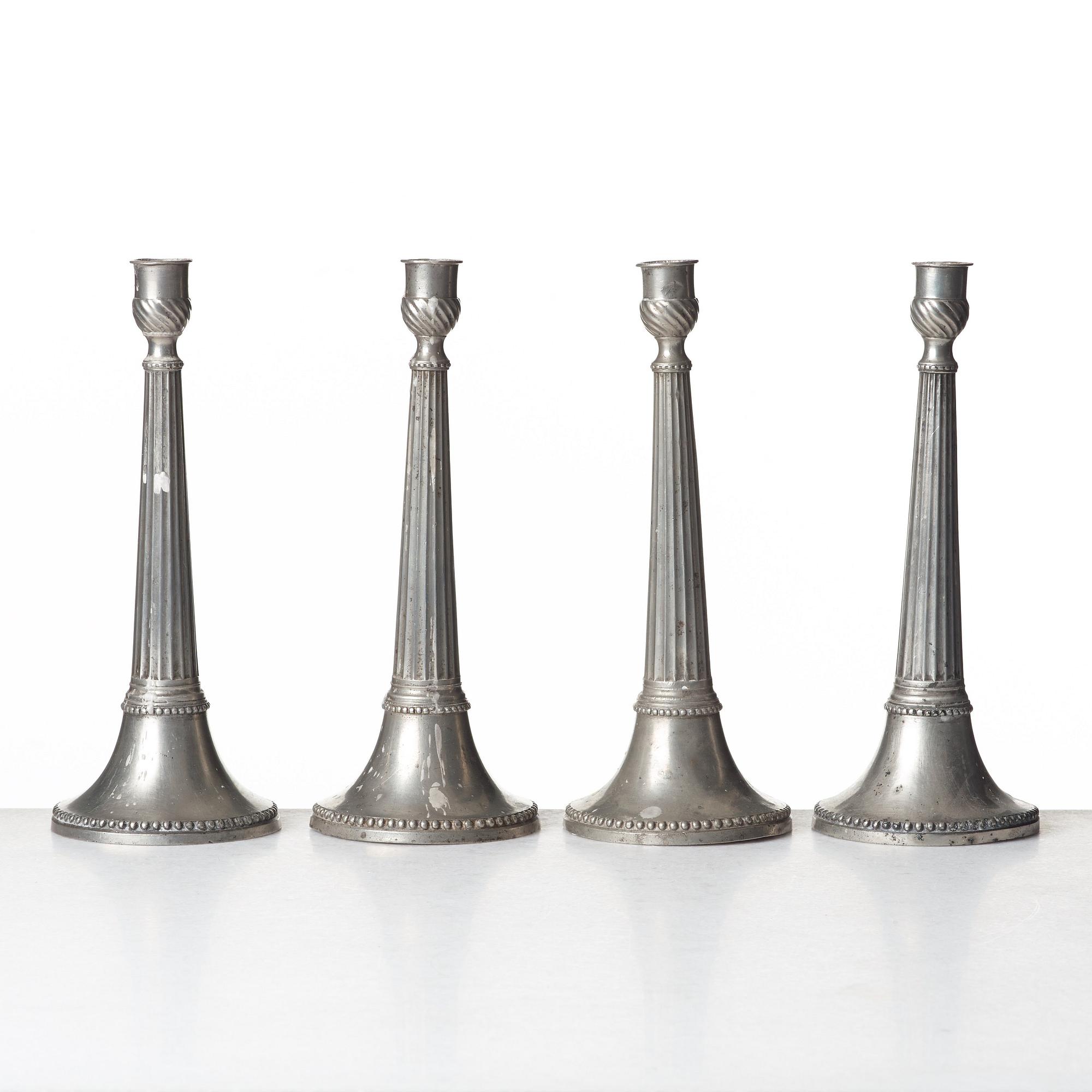 A set of four Swedish late Gustavian pewter candlesticks by E P Krietz, made in Stockholm.