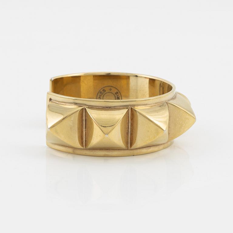 Hermès, a vintage gold tone stud bangle.