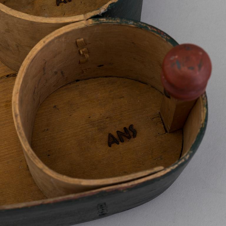 A 19th century folks wooden box in the shape of a loveheart, signed ANS.