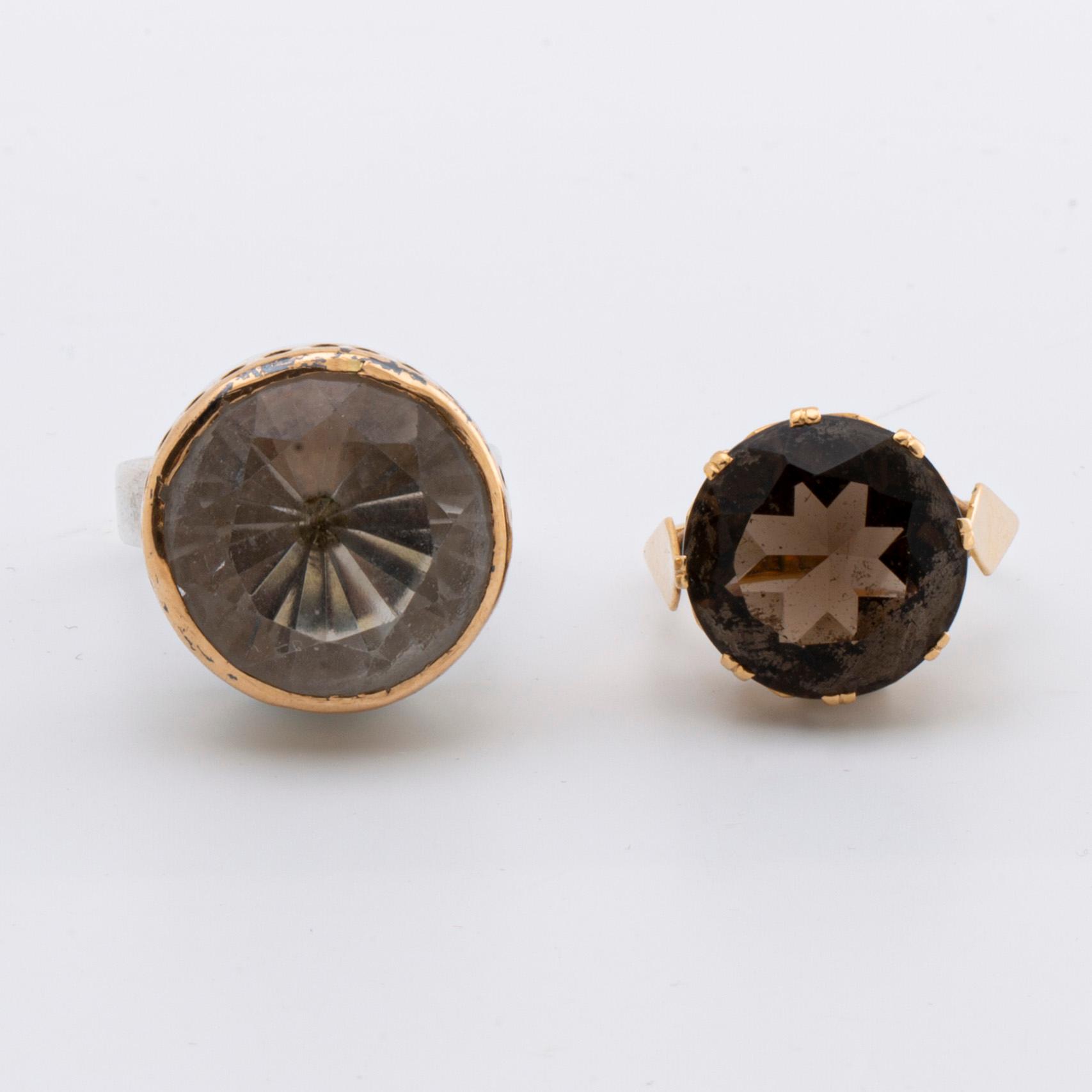 2 RINGS, 18K gold w smoky quartz approx 14 mm, silver and gold w rock crystal approx 16 mm, Stockholm 1963.