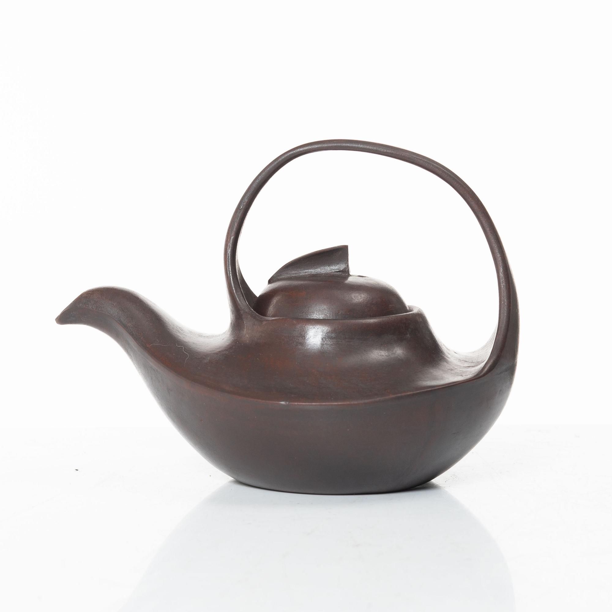 A Chinese compressed yixing teapot and cover, 20th century.