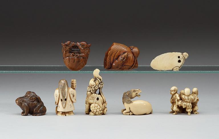 A group of eight wooden-, and bone netsukes, Japan, Meiji (1868-1912).