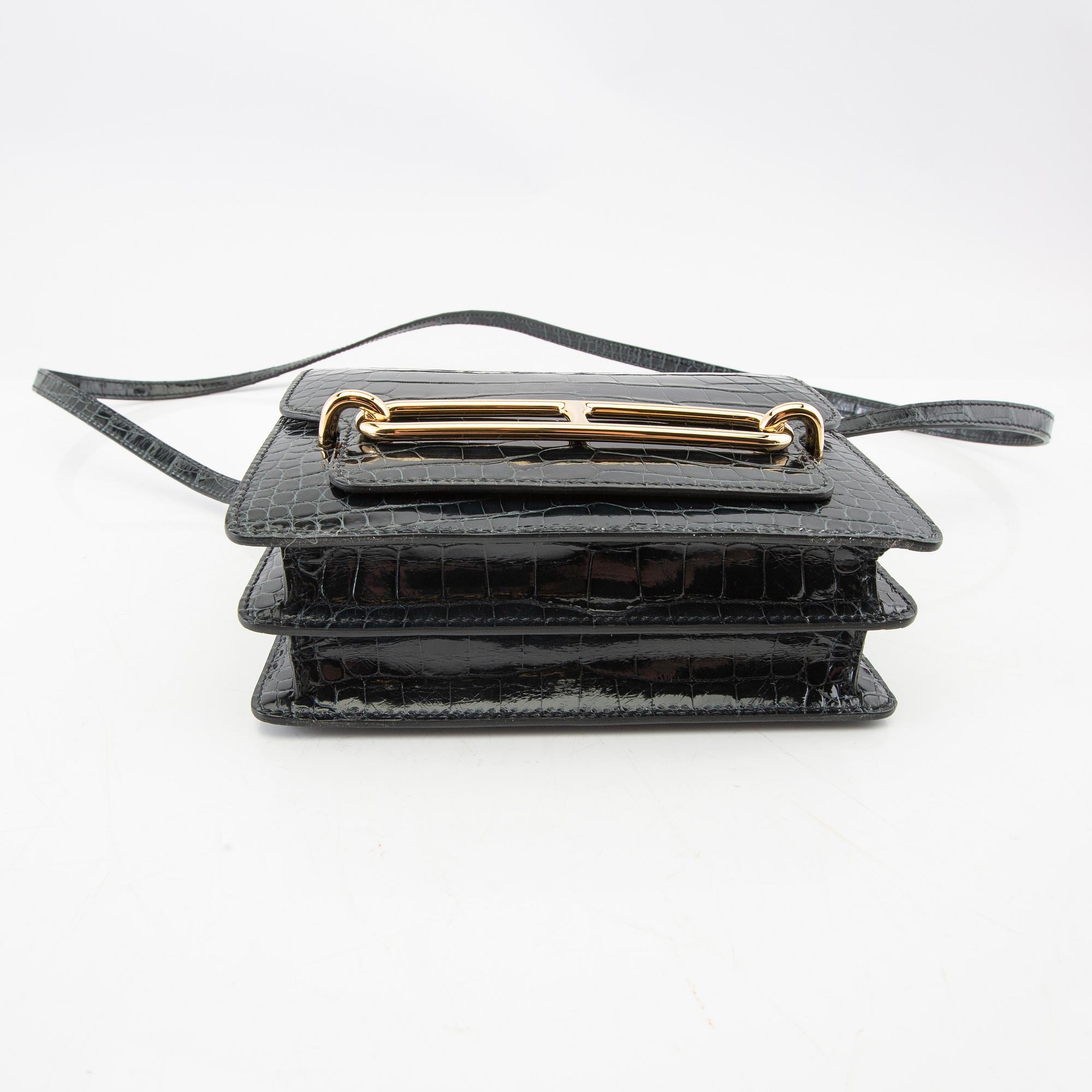 Hermès, bag "Green Shiny Alligator Mini Roulis 18 Permabrass Hardware" 2021.