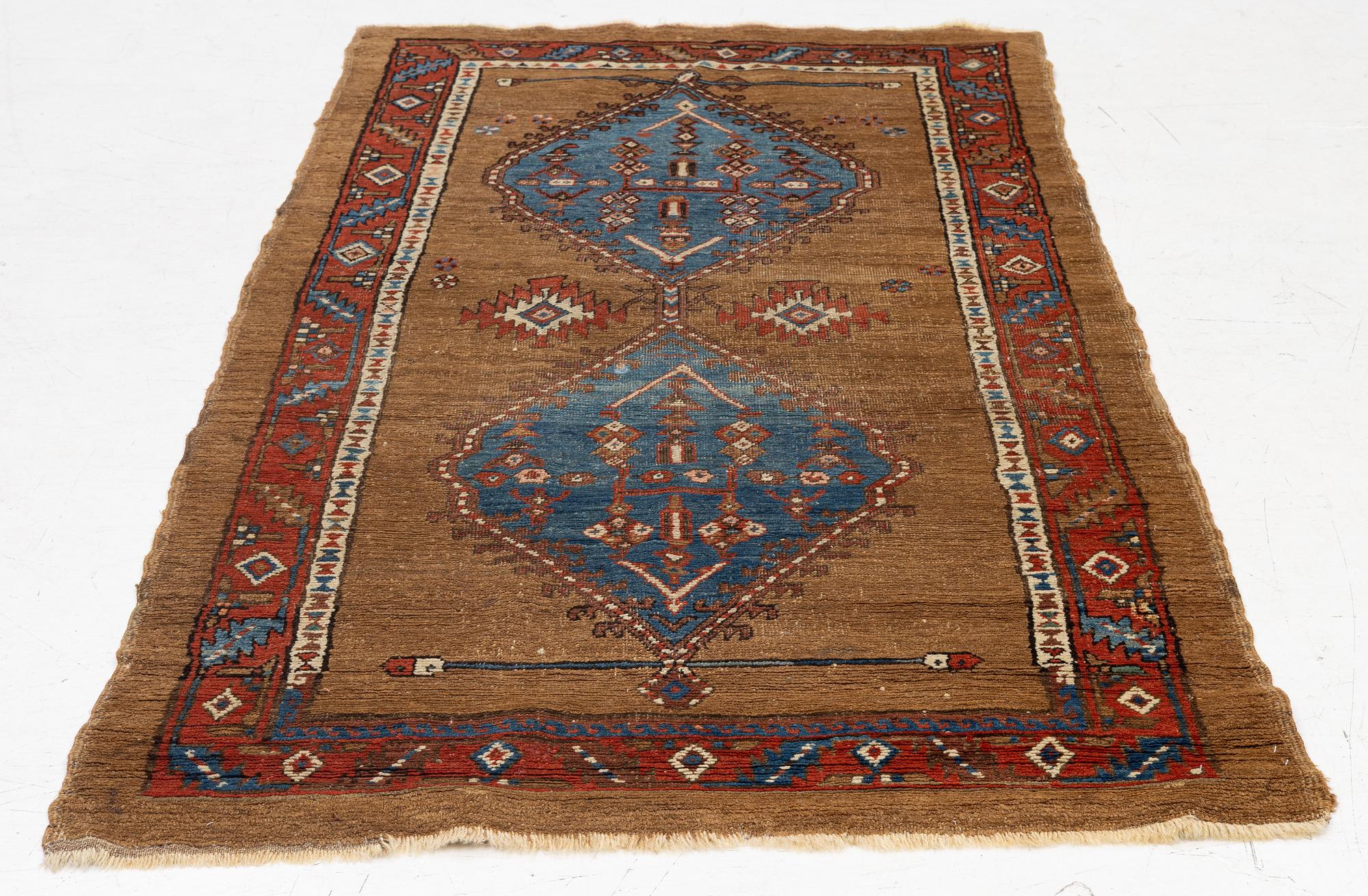 An antique Sarab rug, northwestern Iran, c. 213 x 107 cm.