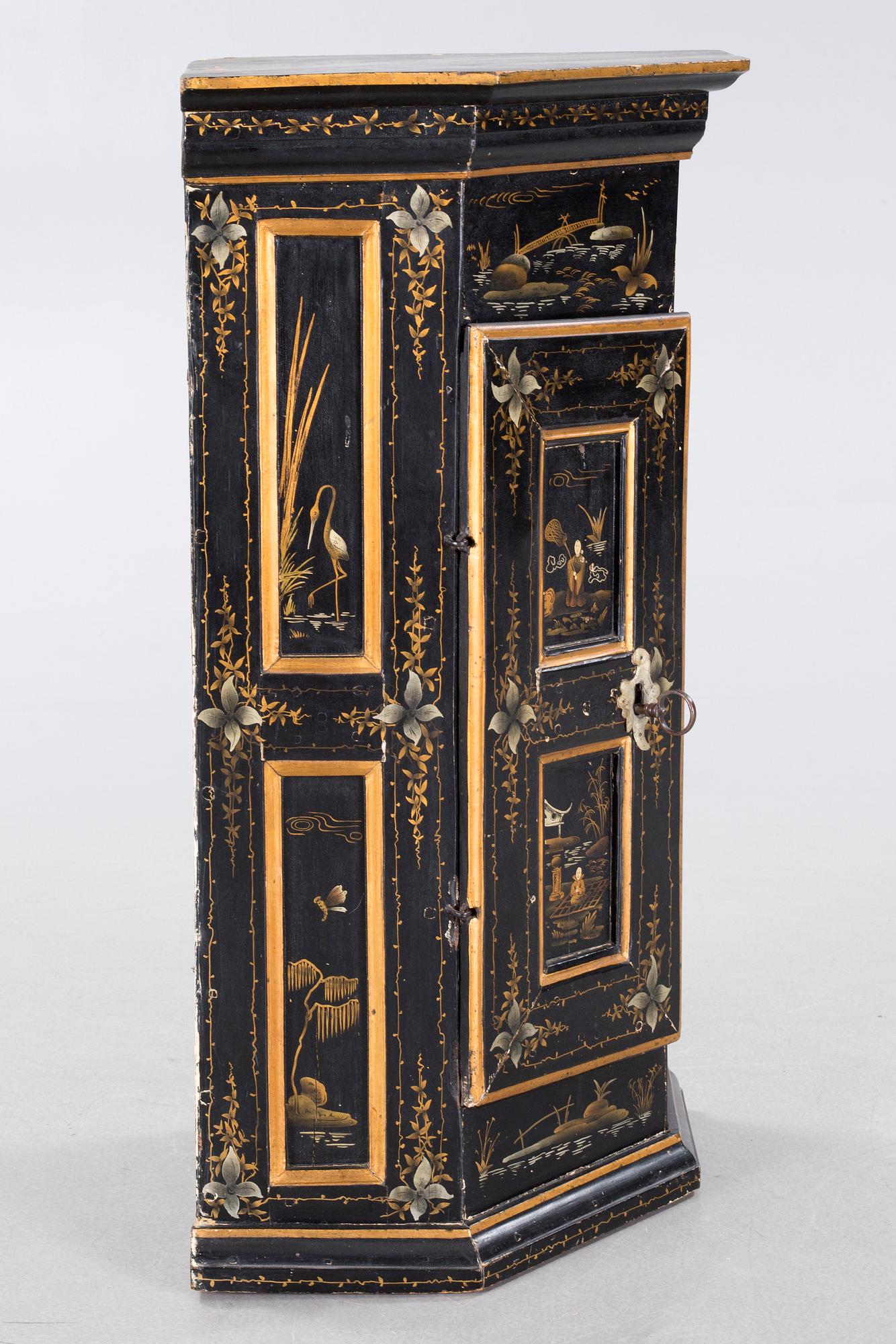 An 18th century corner cabinet.